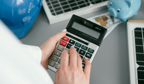 close-up-hand-holding-calculator